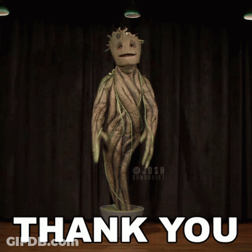 A Statue Of A Tree With The Words Thank You Behind It GIF