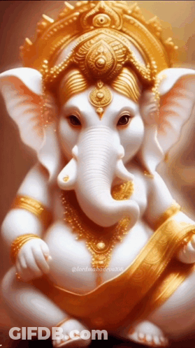 A Statue Of A White And Gold Elephant With A Gold Crown On Its Head GIF