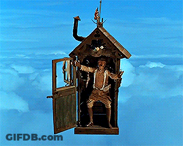 A Statue Of A Woman In A Birdhouse Flying Through The Air GIF