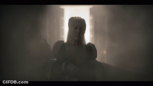 A Statue Of A Woman In A Dark Room GIF