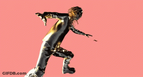 A Statue Of A Woman With Gold And Black Paint On Her Body GIF