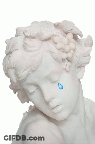 A Statue Of A Woman With Grapes In Her Hair Is Crying GIF