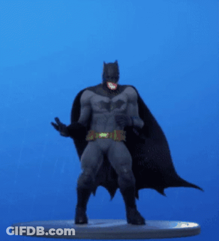 A Statue Of Batman Is Standing On A Blue Background GIF