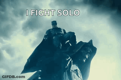 A Statue Of Batman With The Words I Fight Solo Below Him GIF