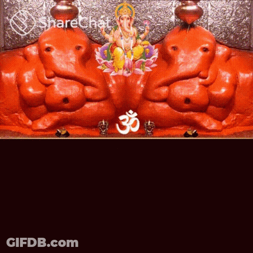 A Statue Of Ganesha And A Statue Of A Deity With An O Symbol GIF