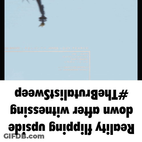 A Statue Of Liberty Is Hanging Upside Down On A Blue Background GIF