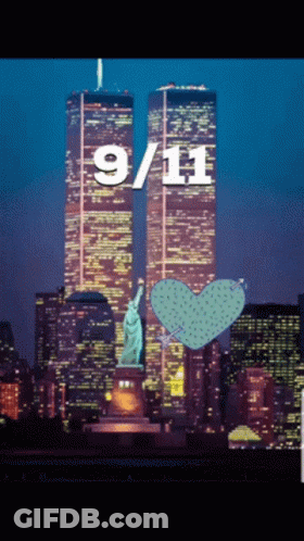 A Statue Of Liberty Stands In Front Of The Twin Towers On September 11Th GIF