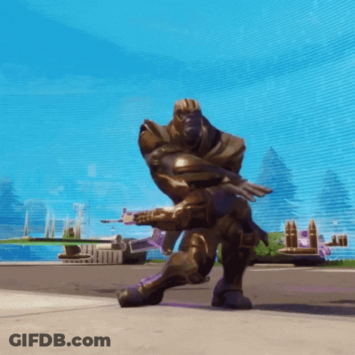 A Statue Of Thanos Is Kneeling Down With A Gun GIF