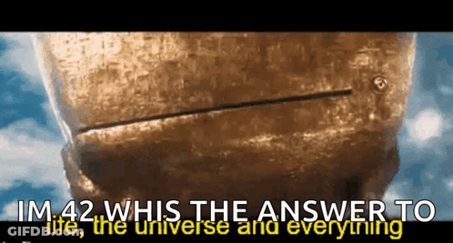 A Statue With The Words Im 42 Whis The Answer To Life The Universe And Everything Written Below It GIF