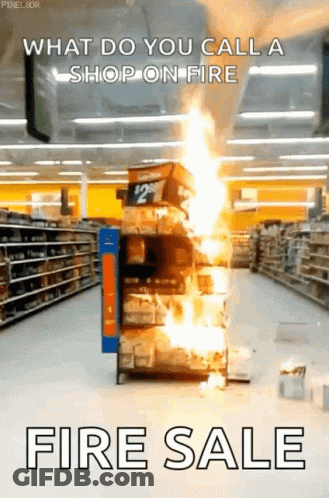A Store Aisle With A Stack Of Boxes On Fire And The Words " What Do You Call A Shop On Fire Fire Sale " GIF