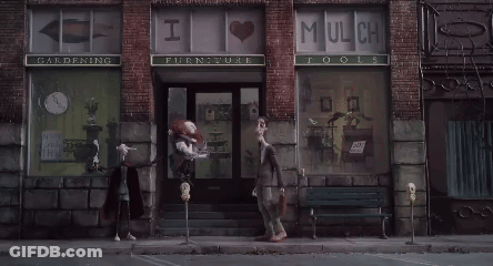A Store Front With A Sign That Says I Love Mulch Tools GIF