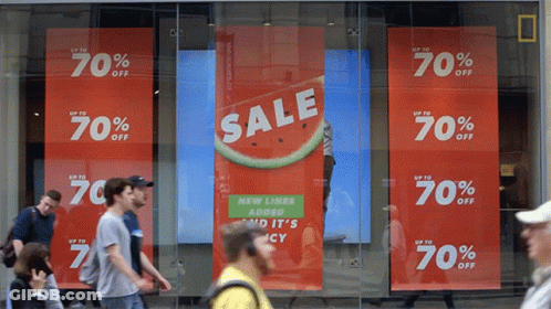 A Store Front With A Sign That Says Sale Up To 70 Percent Off GIF