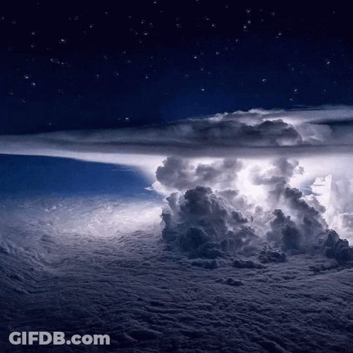 A Storm Is Brewing In The Night Sky With A Lot Of Clouds GIF