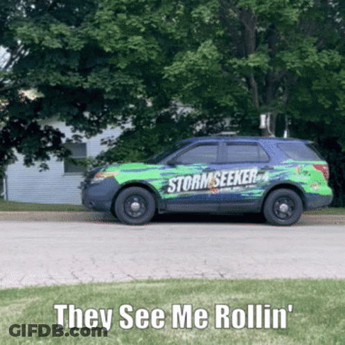 A Storm Seeker Vehicle Is Driving Down The Road GIF