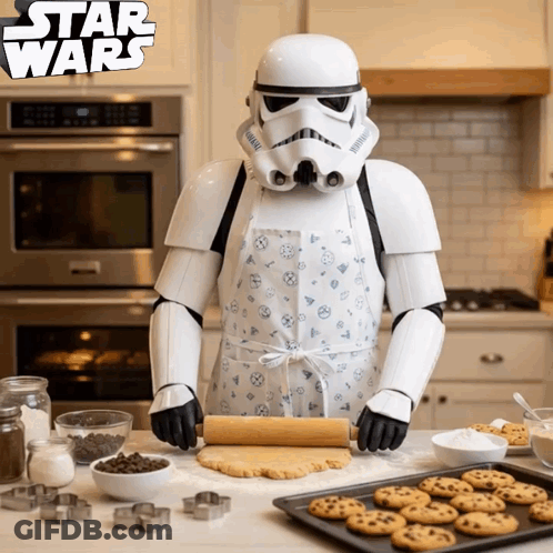 A Storm Trooper In An Apron Is Rolling Out Dough In A Kitchen GIF