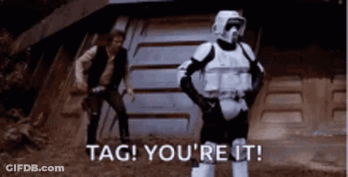 A Storm Trooper Is Standing In Front Of Han Solo . GIF