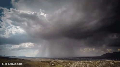 A Stormy Sky Over A City With A Few Clouds GIF