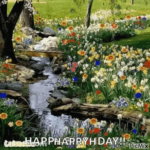A Stream Runs Through A Garden Filled With Lots Of Flowers And Trees . GIF