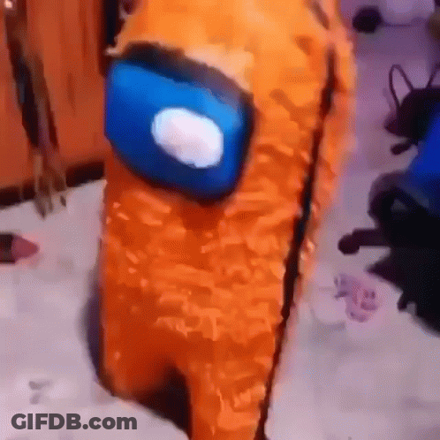 A Stuffed Animal Dressed As An Orange Among Us Character With A Blue Head . GIF