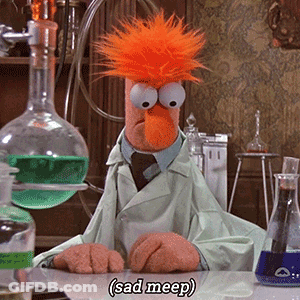 A Stuffed Animal In A Lab Coat Is Sitting At A Table And Says " Sad Mep " GIF