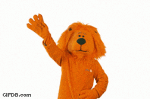 A Stuffed Animal In A Lion Costume Waving GIF