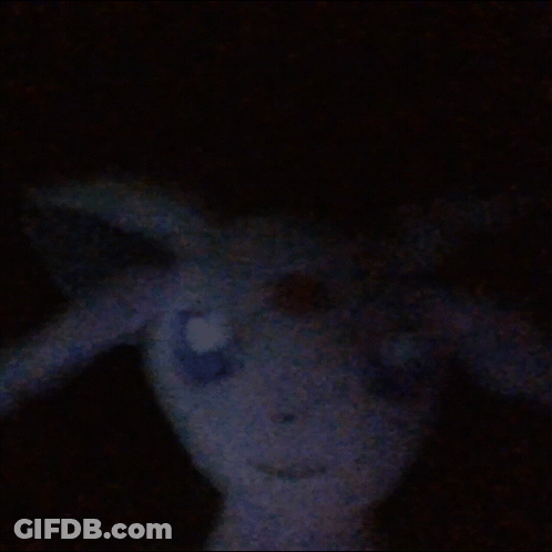 A Stuffed Animal In The Dark Looks Like A Rabbit With Wings GIF