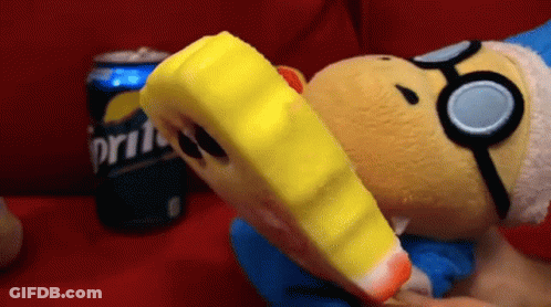 A Stuffed Animal Is Eating A Piece Of Ice Cream Next To A Sprite Can . GIF