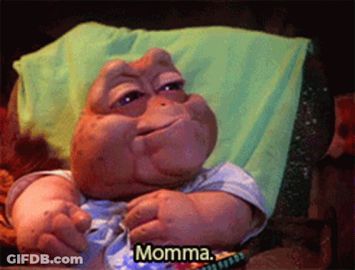 A Stuffed Animal Is Laying On A Couch And Says Momma GIF