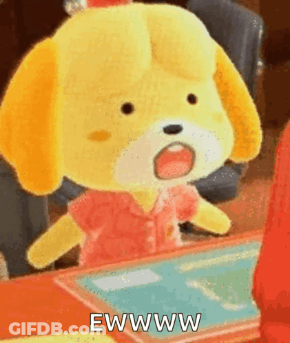 A Stuffed Animal Is Sitting At A Table With Its Mouth Open And The Words Ewww Written On It . GIF