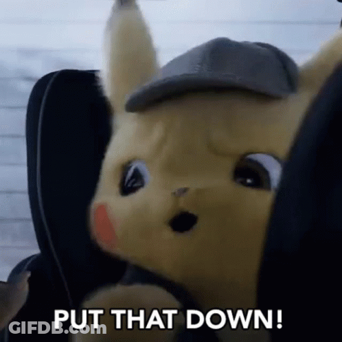 A Stuffed Animal Is Sitting In A Car Seat With The Words `` Put That Down '' Written Next To It . GIF
