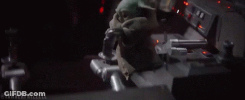 A Stuffed Animal Is Sitting In The Driver 'S Seat Of A Car . GIF