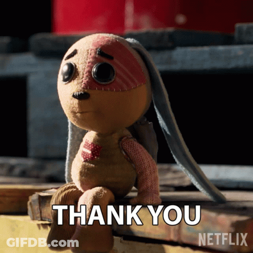 A Stuffed Animal Is Sitting On A Wooden Plank And Says Thank You GIF