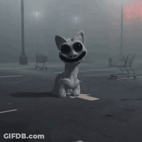 A Stuffed Animal Is Sitting On The Ground In A Parking Lot With Shopping Carts In The Background . GIF