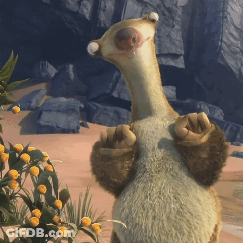 A Stuffed Animal Is Standing In Front Of A Plant GIF