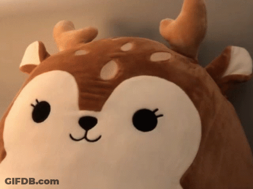 A Stuffed Animal That Looks Like A Deer With Antlers On It GIF