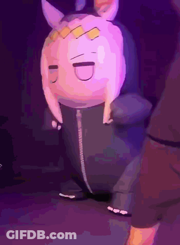 A Stuffed Animal That Looks Like A Rabbit With Horns Is Dancing On A Stage GIF