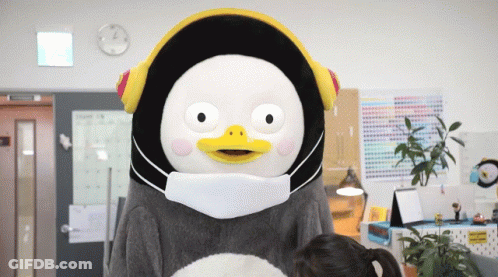 A Stuffed Animal Wearing A Mask And Headphones GIF