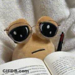 A Stuffed Animal Wearing Glasses Is Reading A Book With A Pen GIF