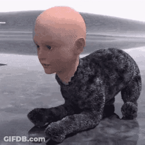 A Stuffed Animal With A Bald Head Is Crawling On A Table . GIF