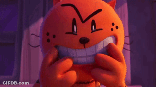 A Stuffed Animal With A Big Smile On Its Face Is Making A Funny Face . GIF