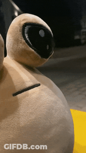 A Stuffed Animal With A Black Eye And A White Nose GIF