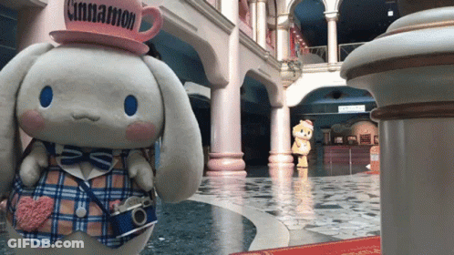 A Stuffed Animal With A Cinnamon Hat On GIF