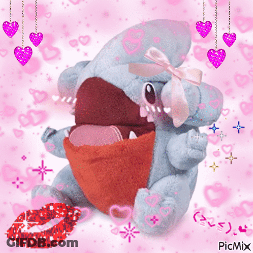 A Stuffed Animal With A Pink Bow On Its Head Is Surrounded By Pink Hearts And Says Picmix On The Bottom GIF