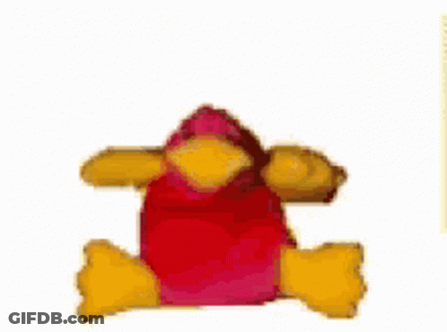 A Stuffed Animal With A Red Head And Yellow Arms Is Laying Down On A White Surface . GIF