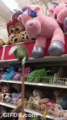 A Stuffed Animal With A Tag That Says Build A Bear On It GIF