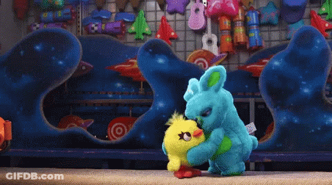 A Stuffed Animal With A Tag That Says " Bunny " On It GIF