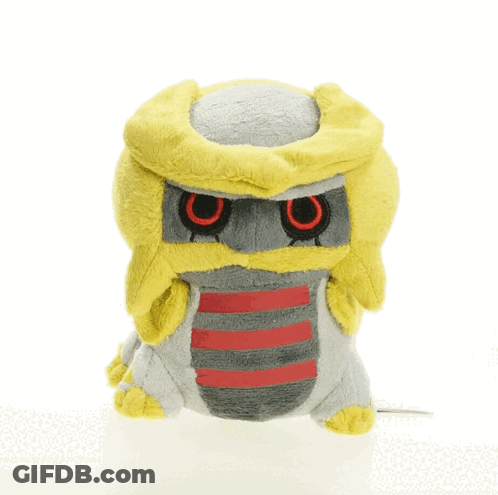 A Stuffed Animal With A Yellow Head And Red Eyes Is Sitting On A White Surface GIF