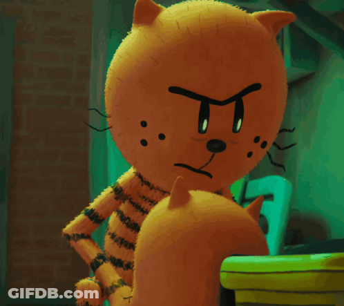 A Stuffed Animal With An Angry Face Is Standing Next To A Smaller Stuffed Animal GIF