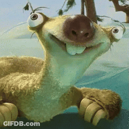 A Stuffed Animal With Big Eyes Is Smiling And Laying On Its Back GIF
