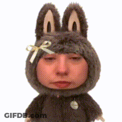 A Stuffed Animal With Bunny Ears And A Bow GIF